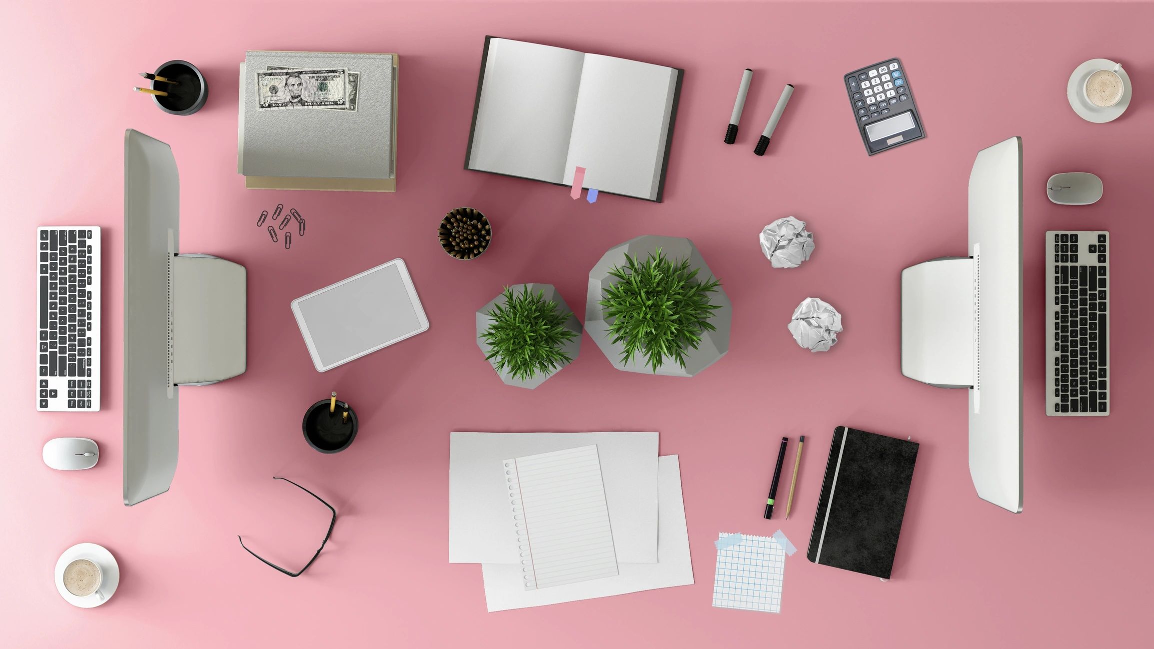Top view of a modern office desk with laptop and notebooks